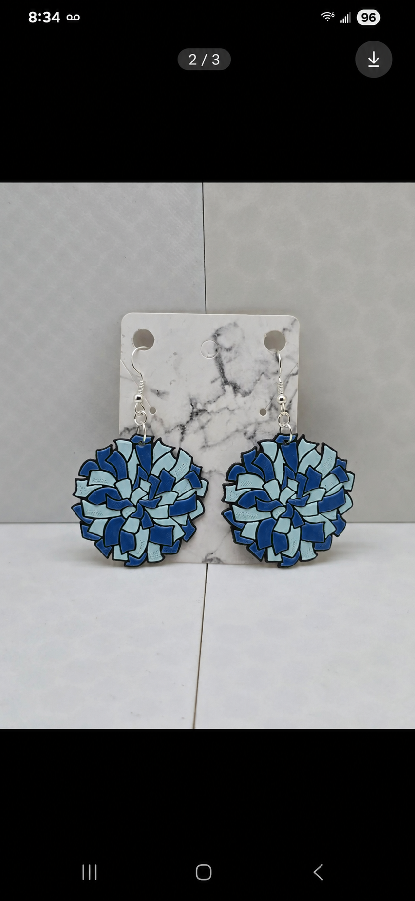 Pom-pom cheer team earrings in blue — real product photo