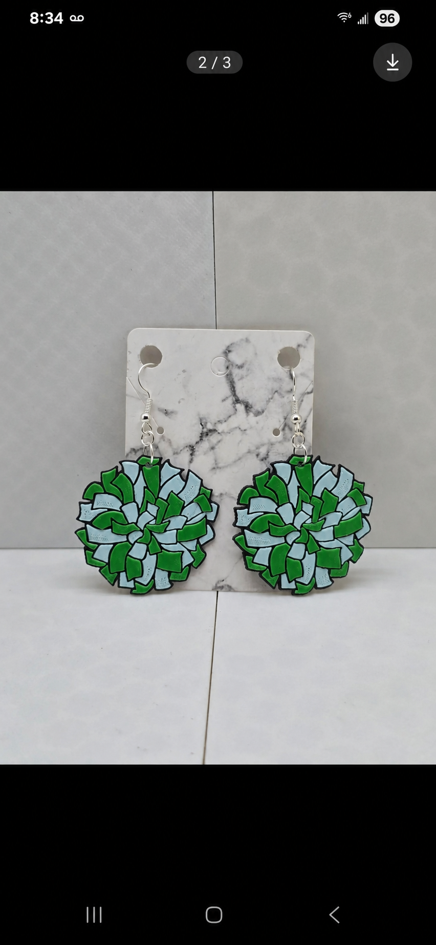 Pom-pom cheer team earrings in green — real product photo